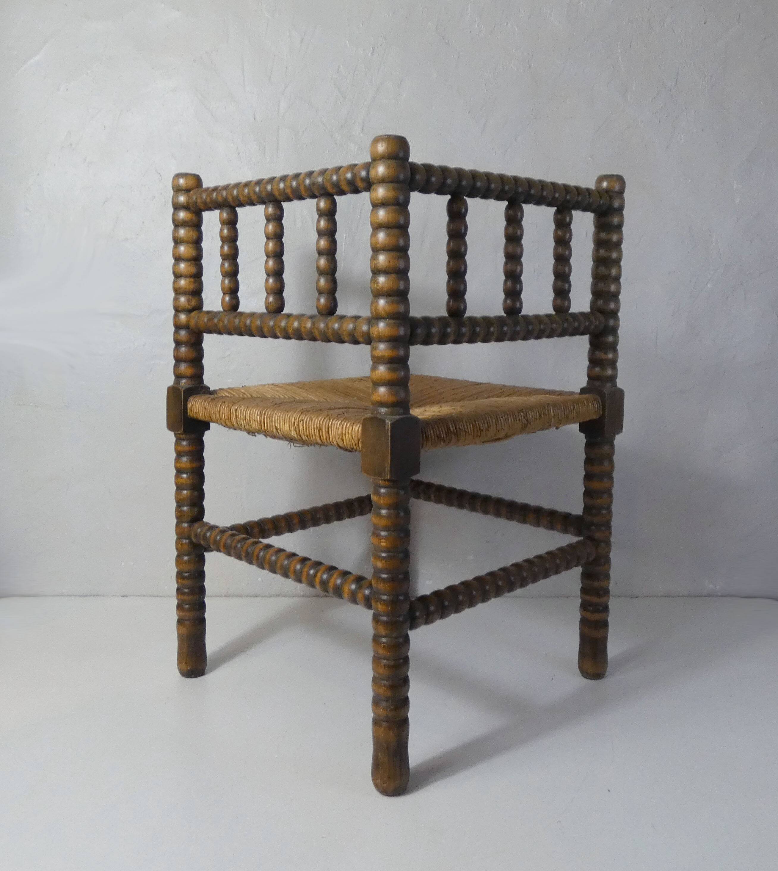 Old corner armchair beaded wood paillé