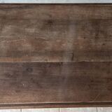 Wrought iron table with a walnut top.