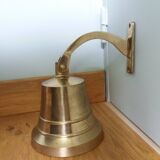 Wall entrance bell with bracket