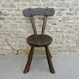 Brutalist chair in carved solid wood, around 1950.