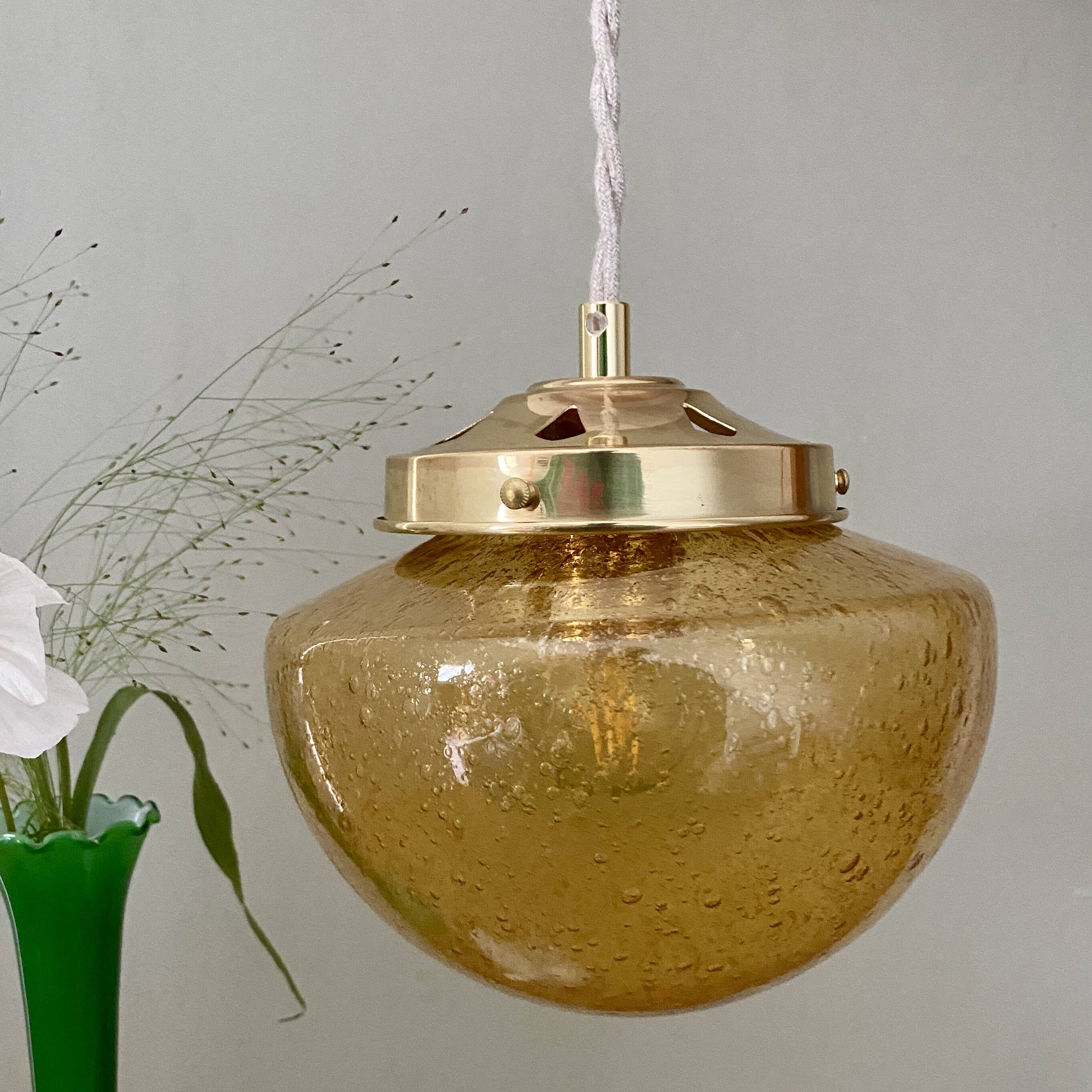 Vintage globe pendant light in bubbled amber glass