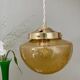 Vintage globe pendant light in bubbled amber glass