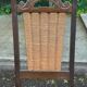 4 Basque solid wood dining chairs with carved straw seats.