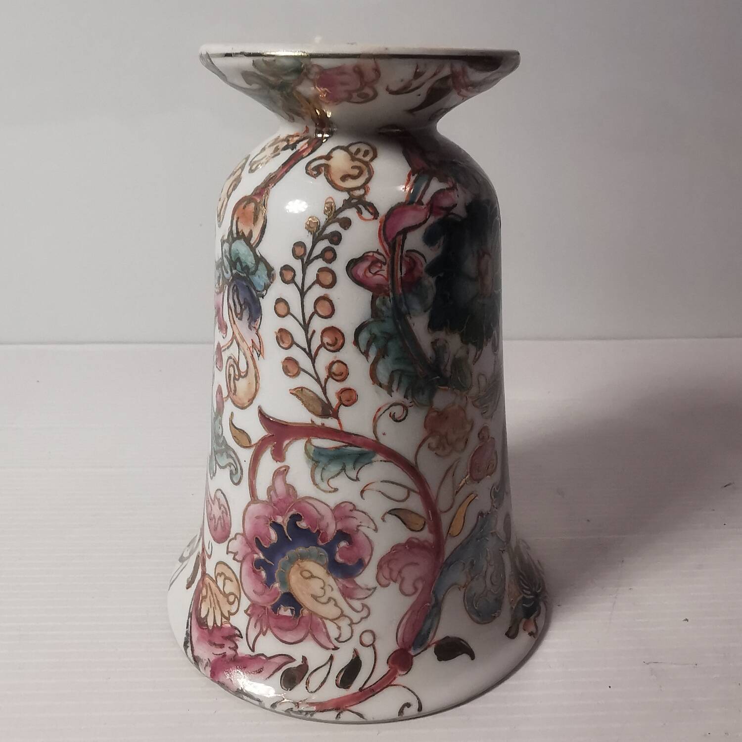 Old vintage vase with floral decor