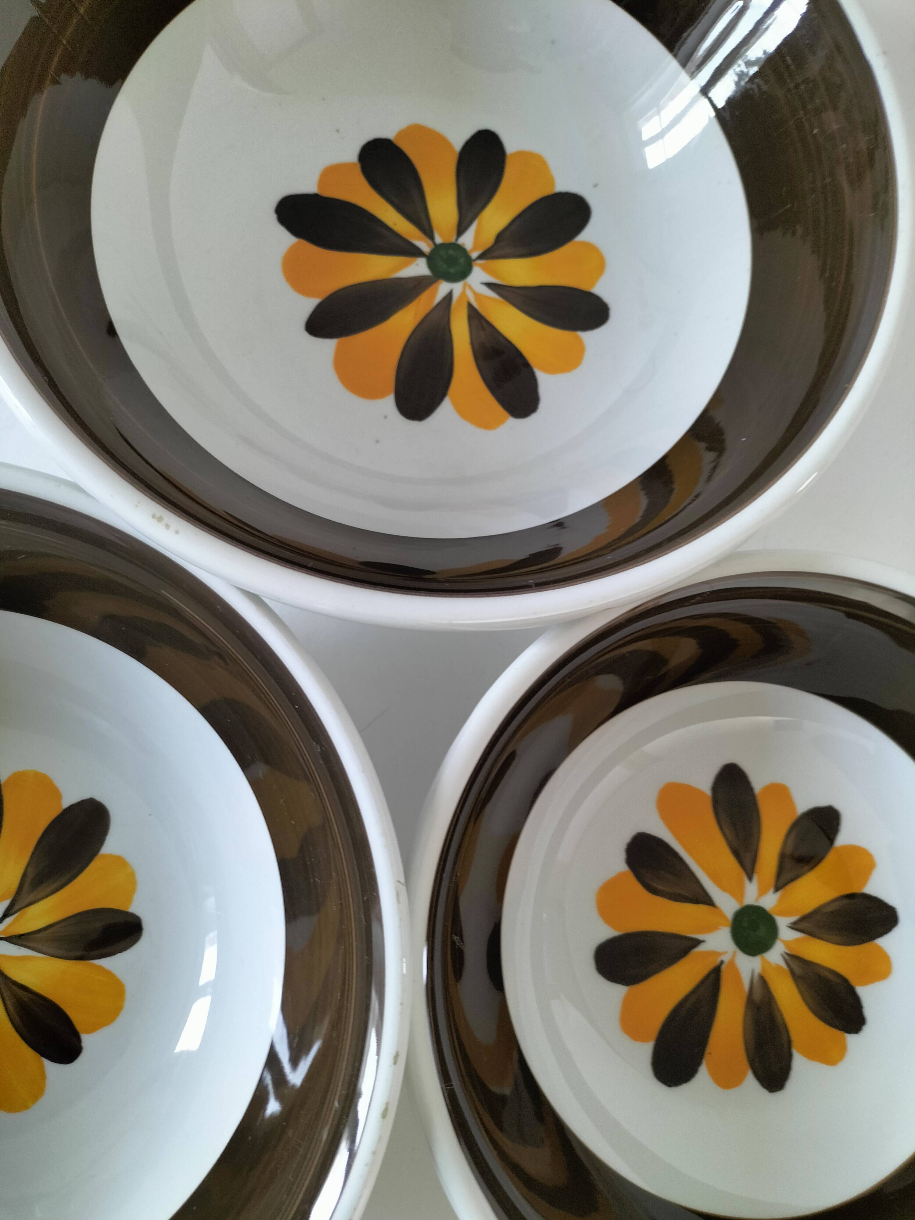 Trio of Italian 1970s deep plates, ochre brown floral decoration
