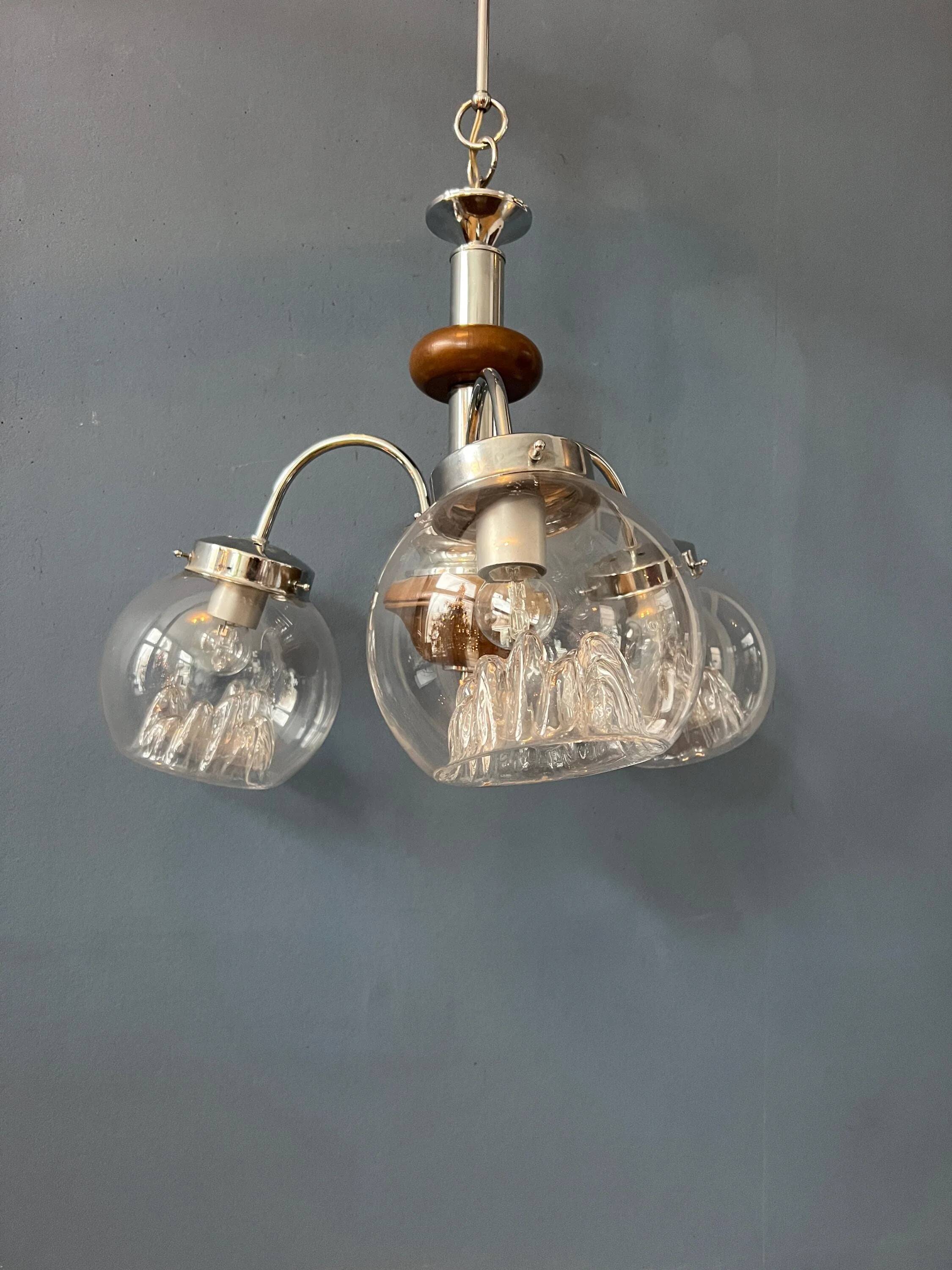 Vintage transparent glass chandelier from Murano with a chrome structure.