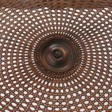 Side table with sculpted elements and rattan top