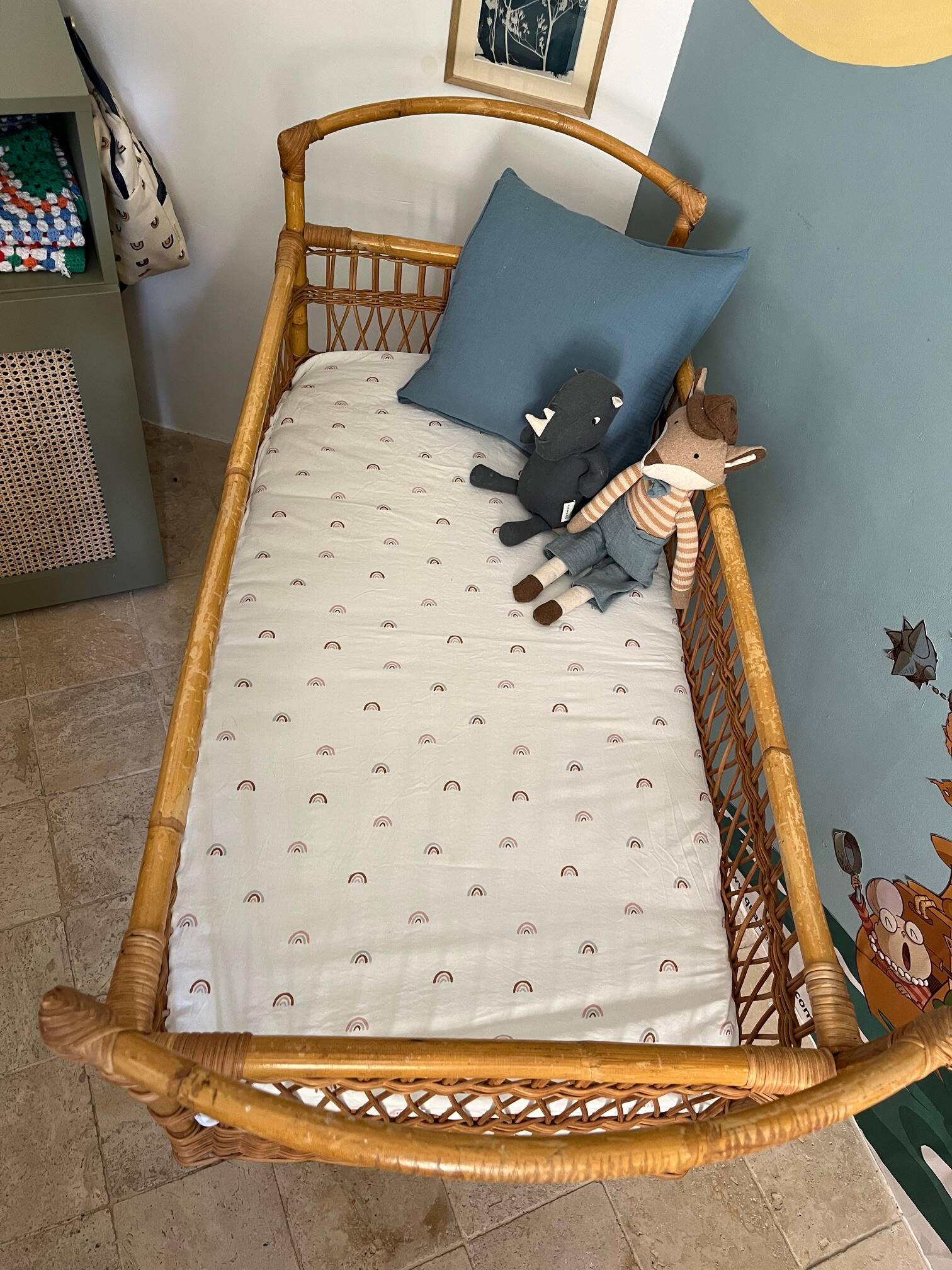 Vintage rattan baby bed with wheels