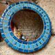 Round ceramic mirror with blue mosaic decor circa 1960