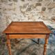 French vintage side table in cherry wood with a drawer.