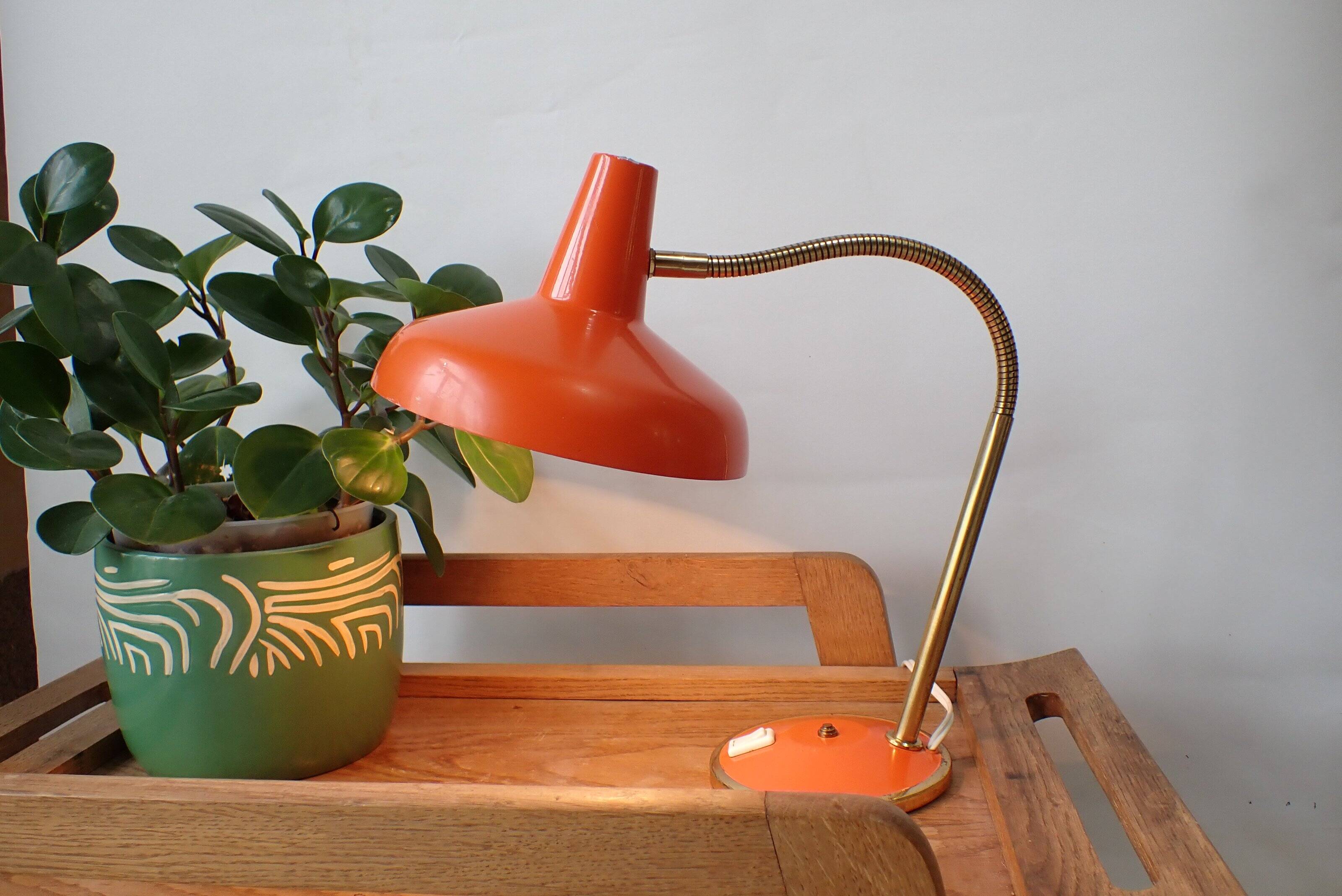 Vintage adjustable lamp, orange, made of metal.