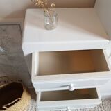 Old white asymmetrical chest of drawers
