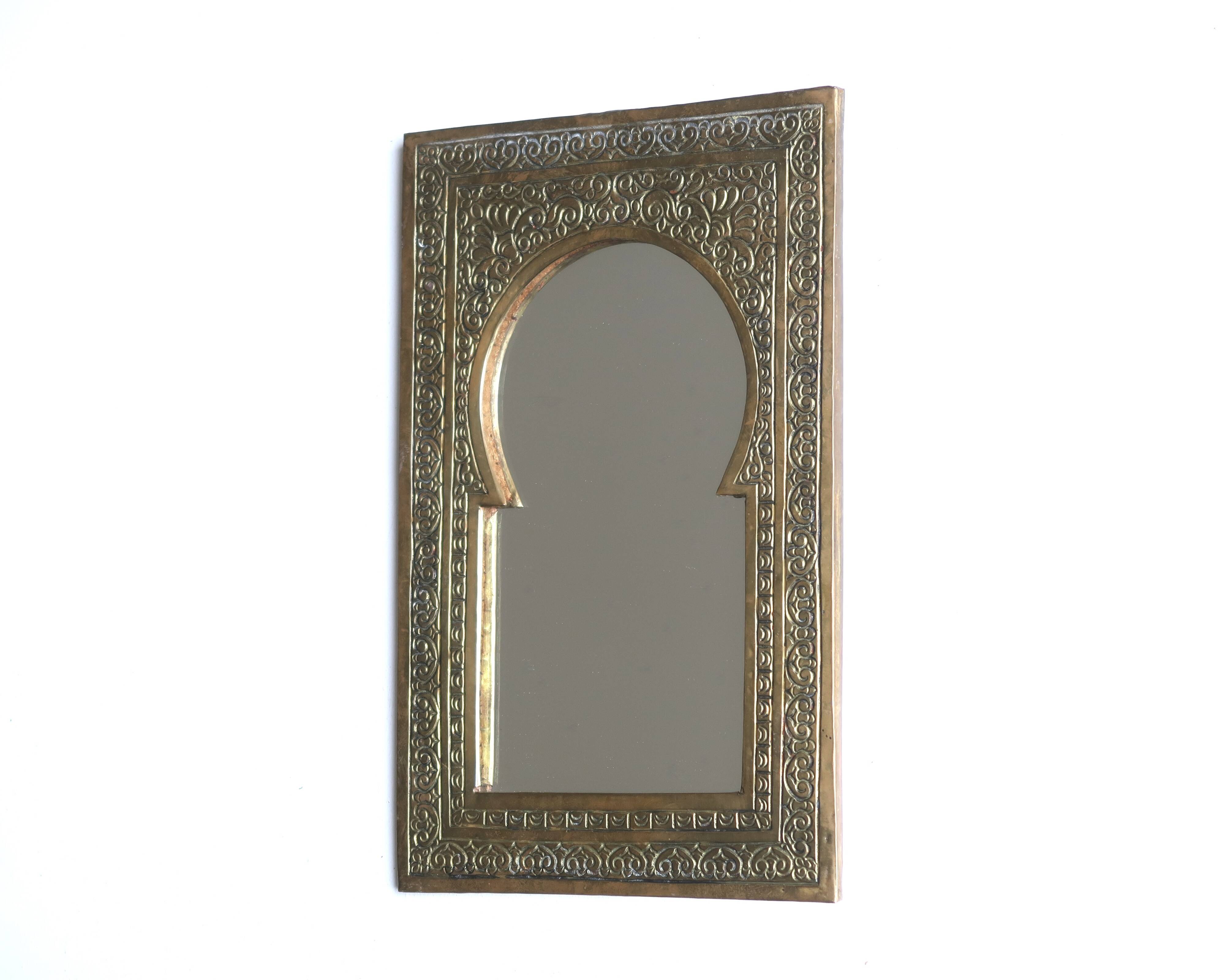 Rectangular Moroccan mirror in brass resembling a door, 1970s.