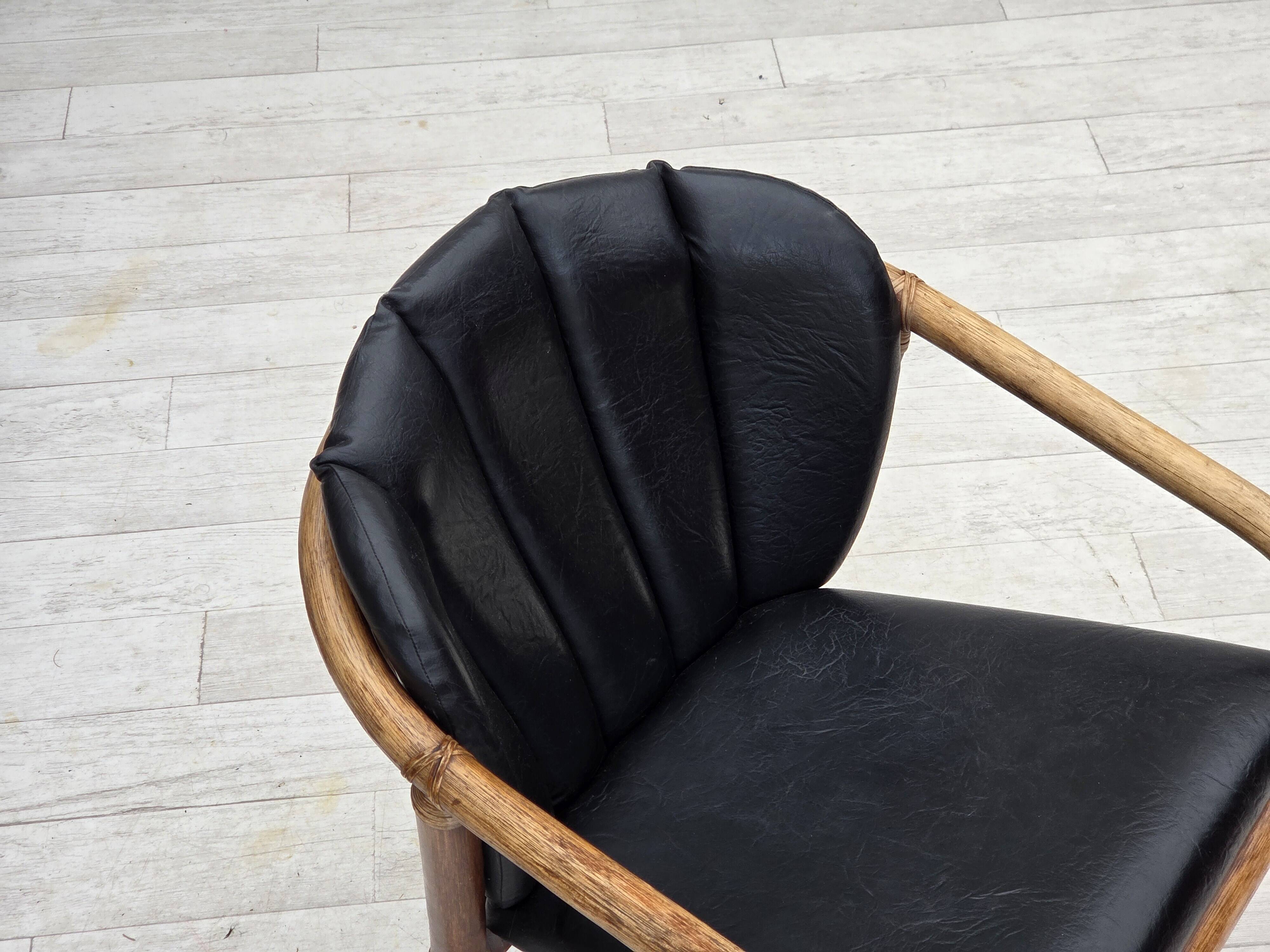 1970s, Danish armchair, rattan, black artificial leather.