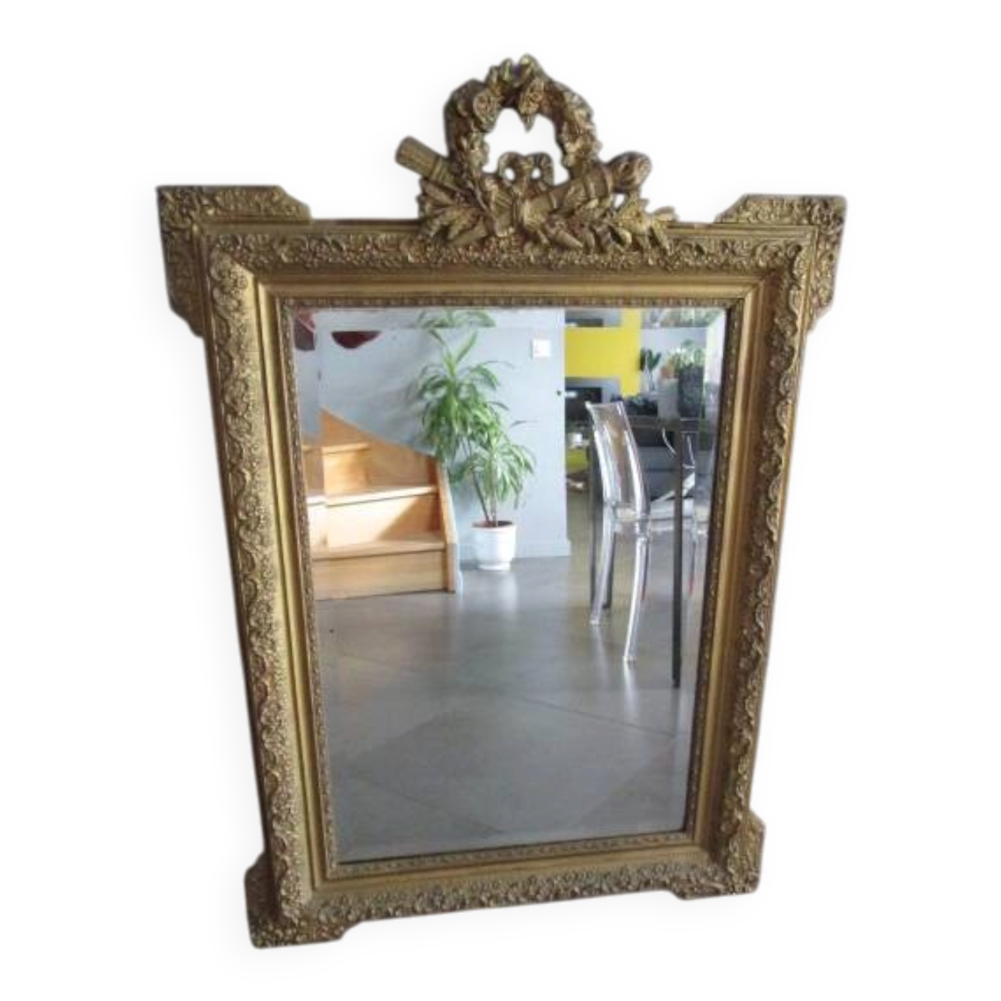 Large antique mirror in wood and gilded stucco.
