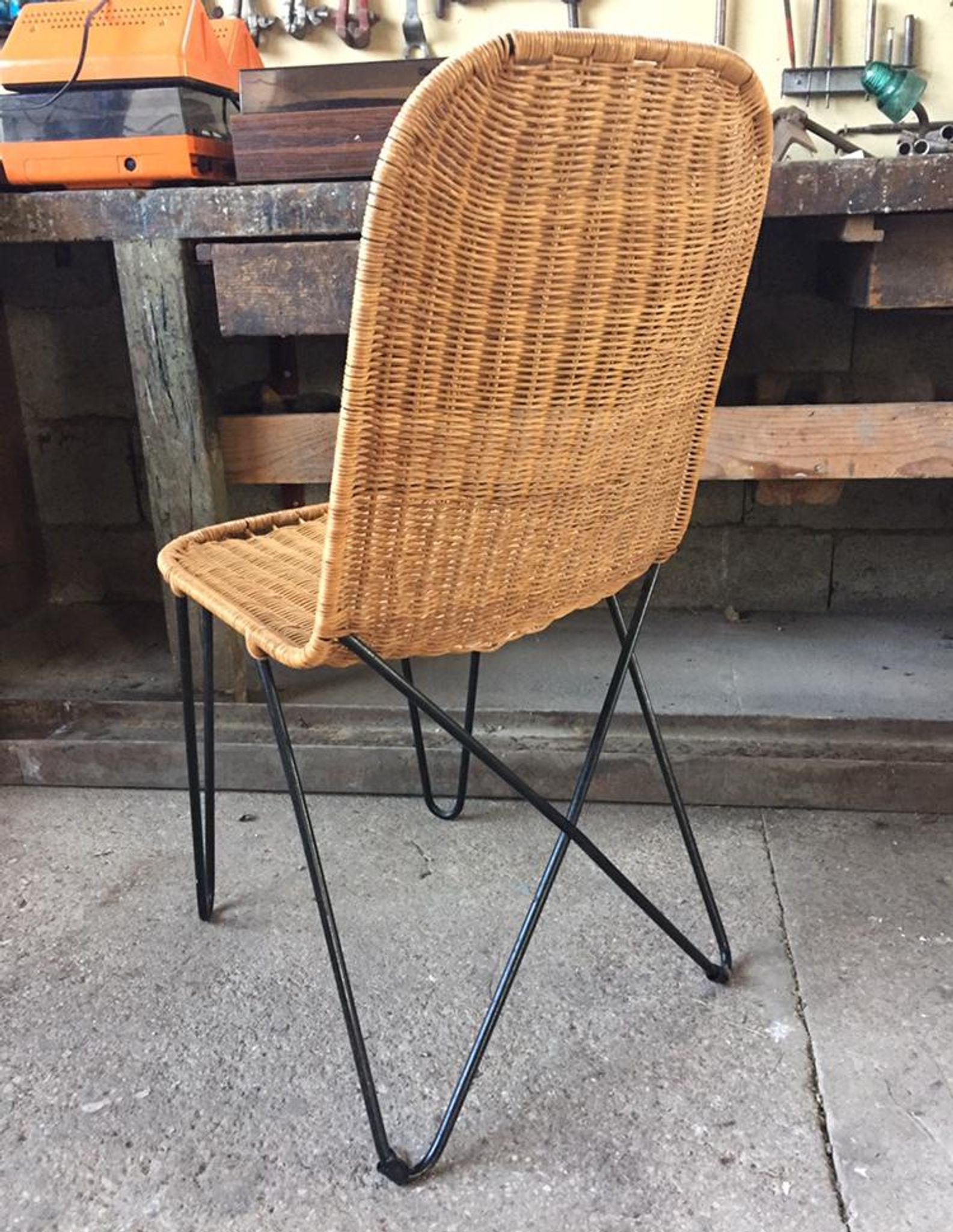 raoul guys chair in rattan and metal base year 50