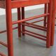 Set of two red vintage wooden chairs from the 1970s with woven rattan seats