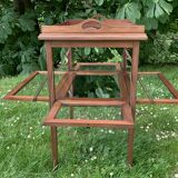 Glass-enclosed old tea table with wooden tray, bronze and brass