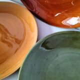 Set of green and amber enamelled plates