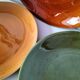 Set of green and amber enamelled plates