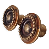 Pair of antique furniture knobs in gilded brass.