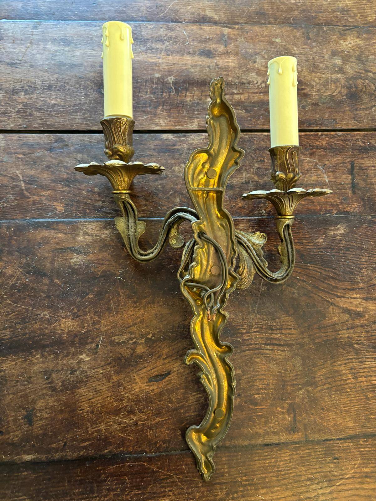 Pair of Louis XV Style wall lights in gilded bronze