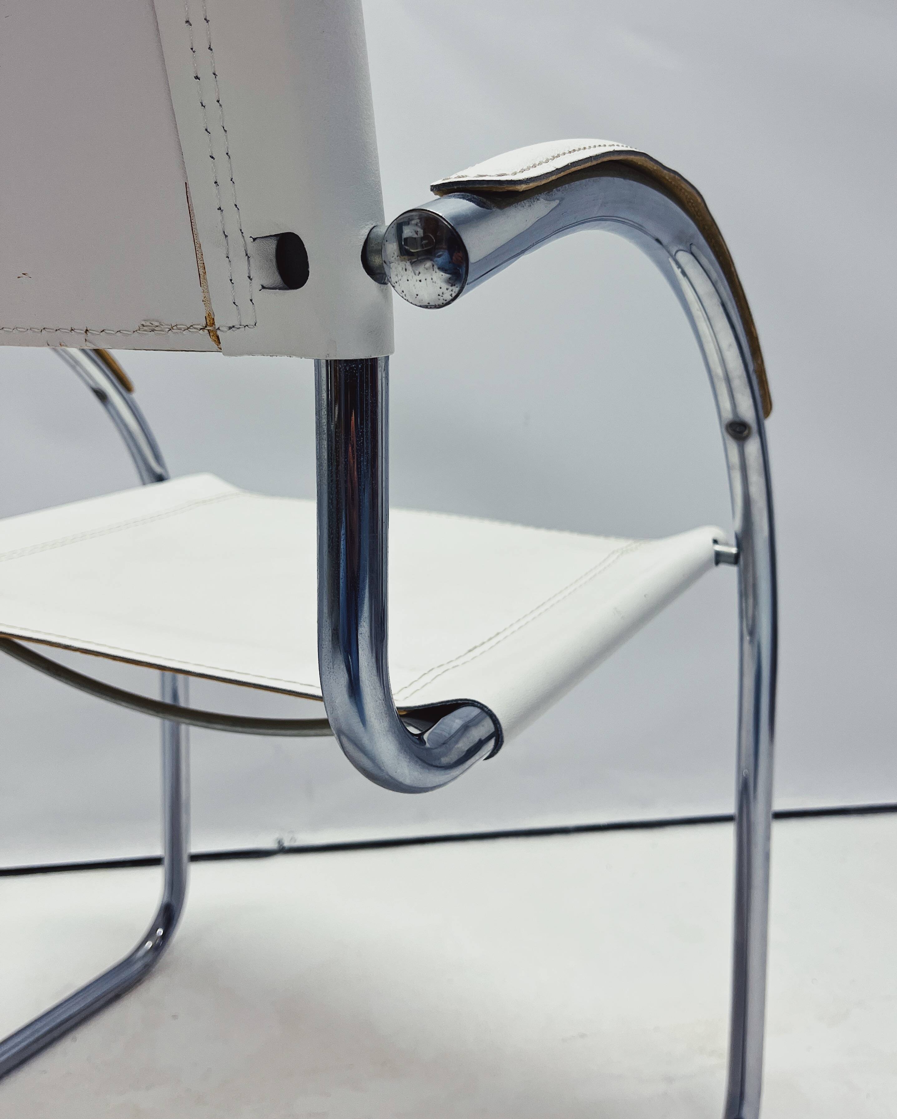 Vintage tubular frame chairs with white skai