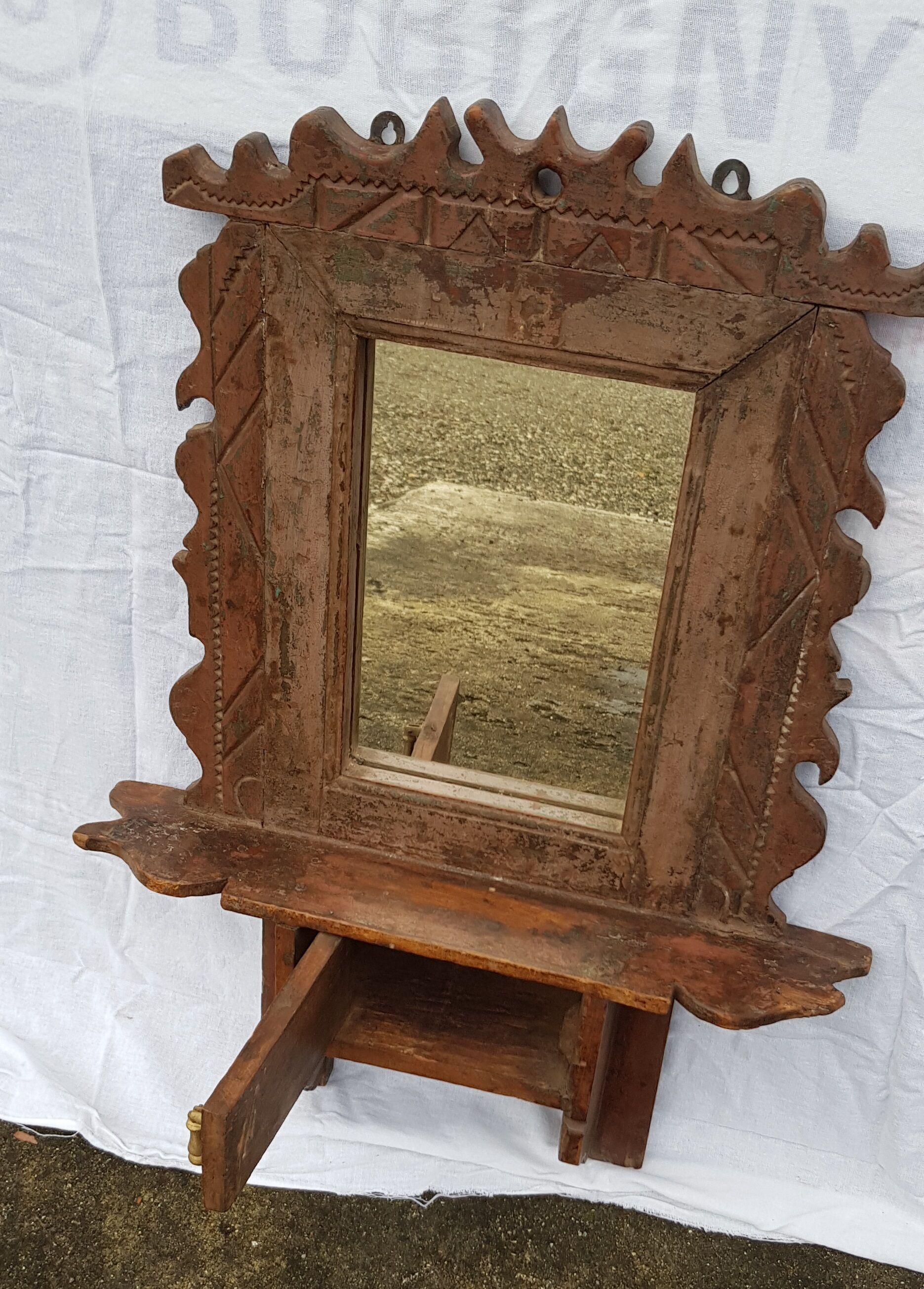 Old barber's mirror in teak