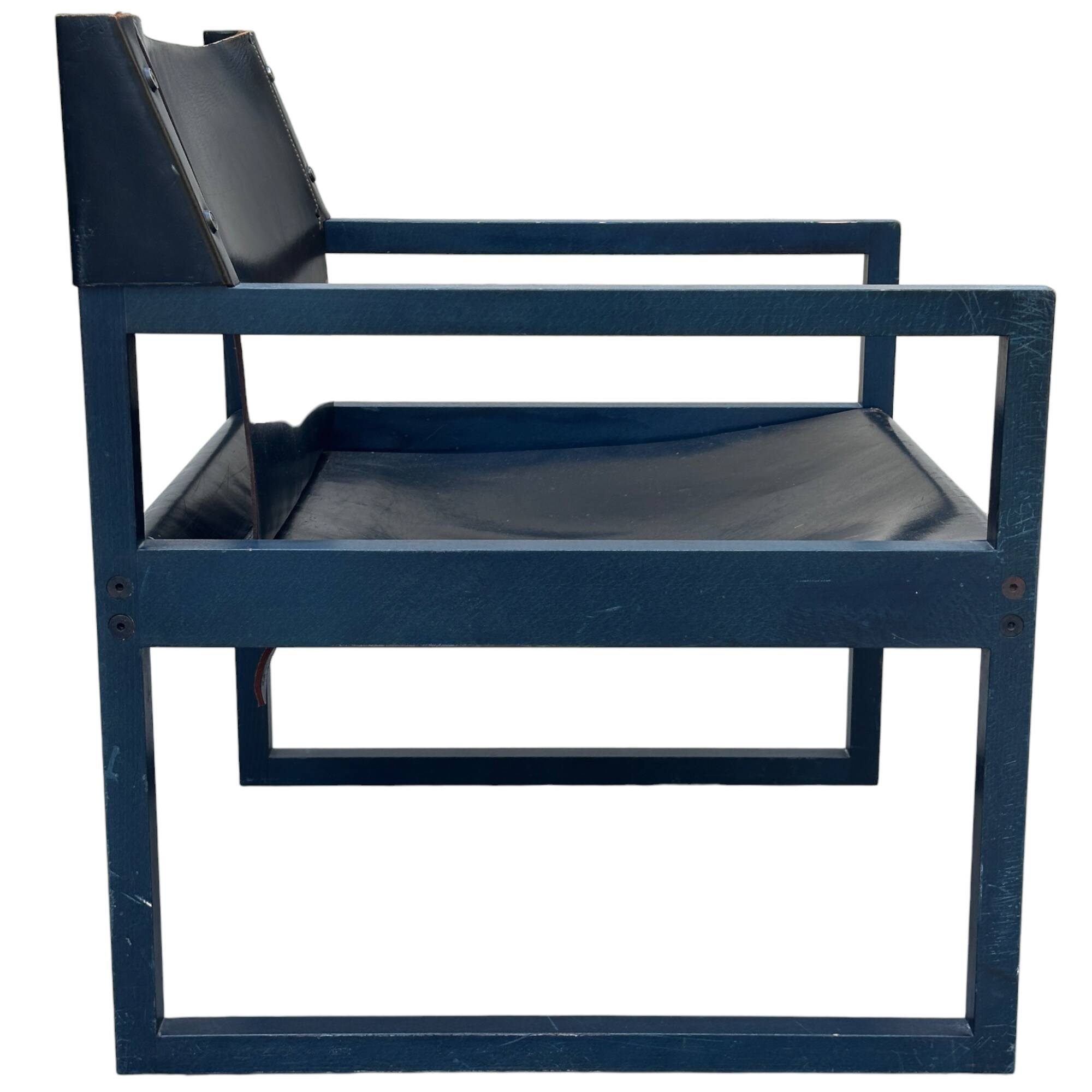 Postmodern lounge chair in black saddle leather and midnight blue wood, 1980.