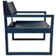 Postmodern lounge chair in black saddle leather and midnight blue wood, 1980.