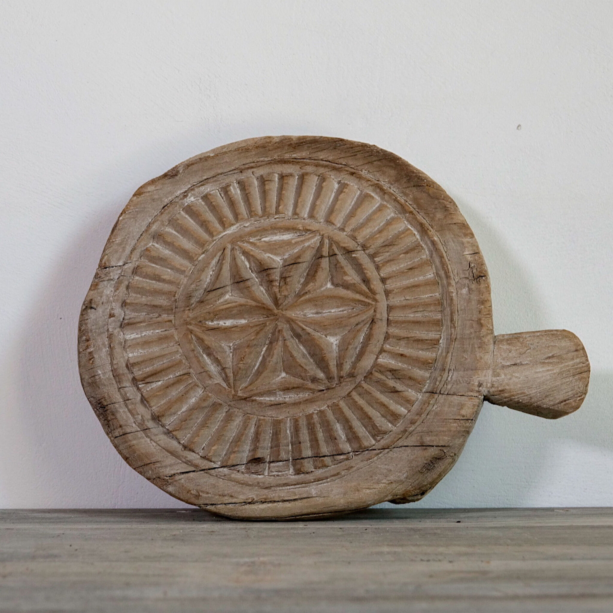 Carved wooden chapatis board