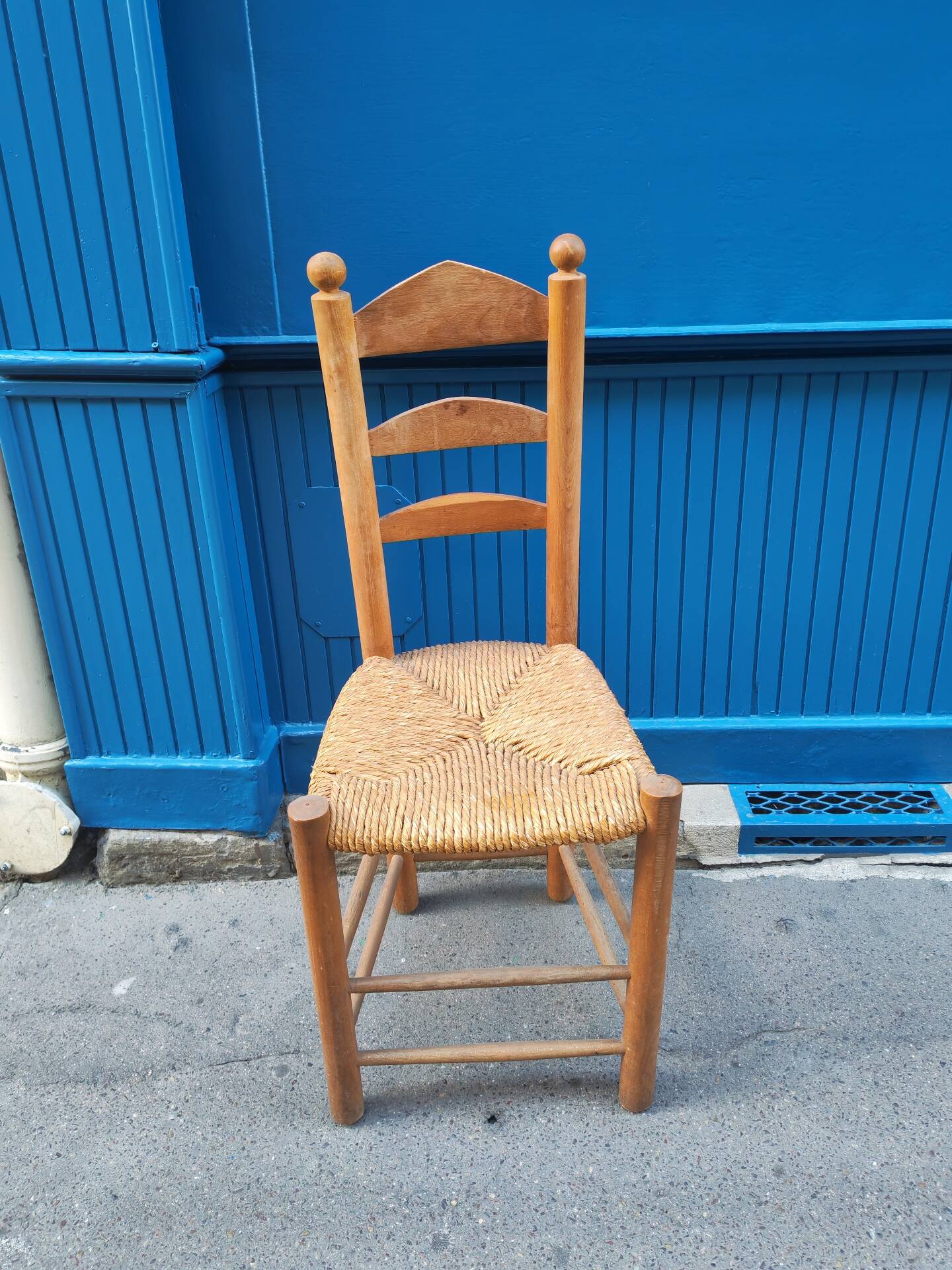 Neo-rustic chair in wood and wicker in the brutalist style by Charles Dudyoyut.