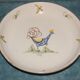 Plat à décor de coq , signé