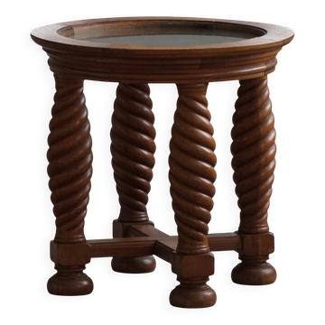 Modern Danish mid-century table, made of oak with spiral turned legs and a glass top, 1950s.