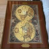 Wood and brass coffee table with a world map under glass.