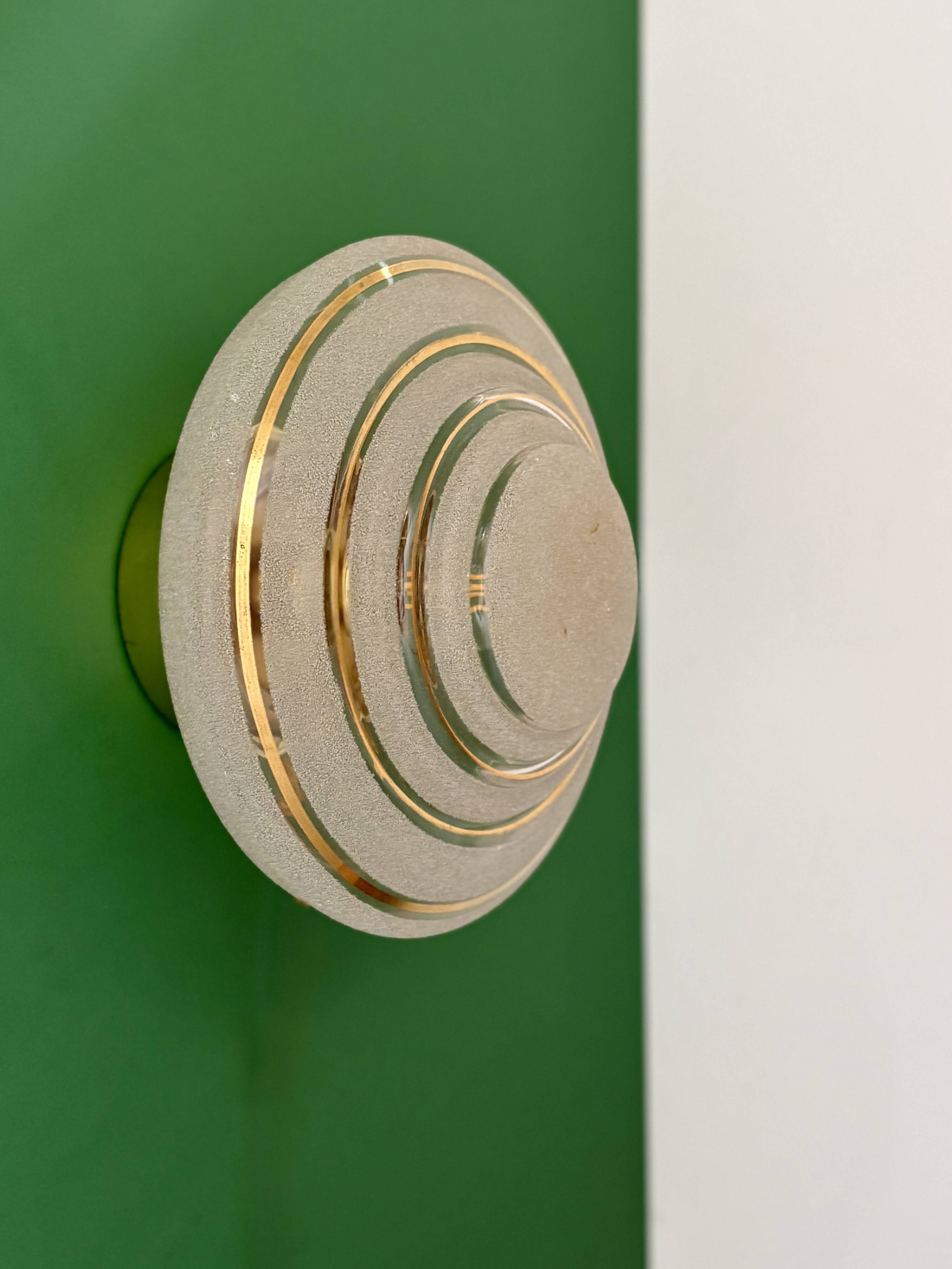 Old glass globe wall/ceiling light in frosted white and gold.