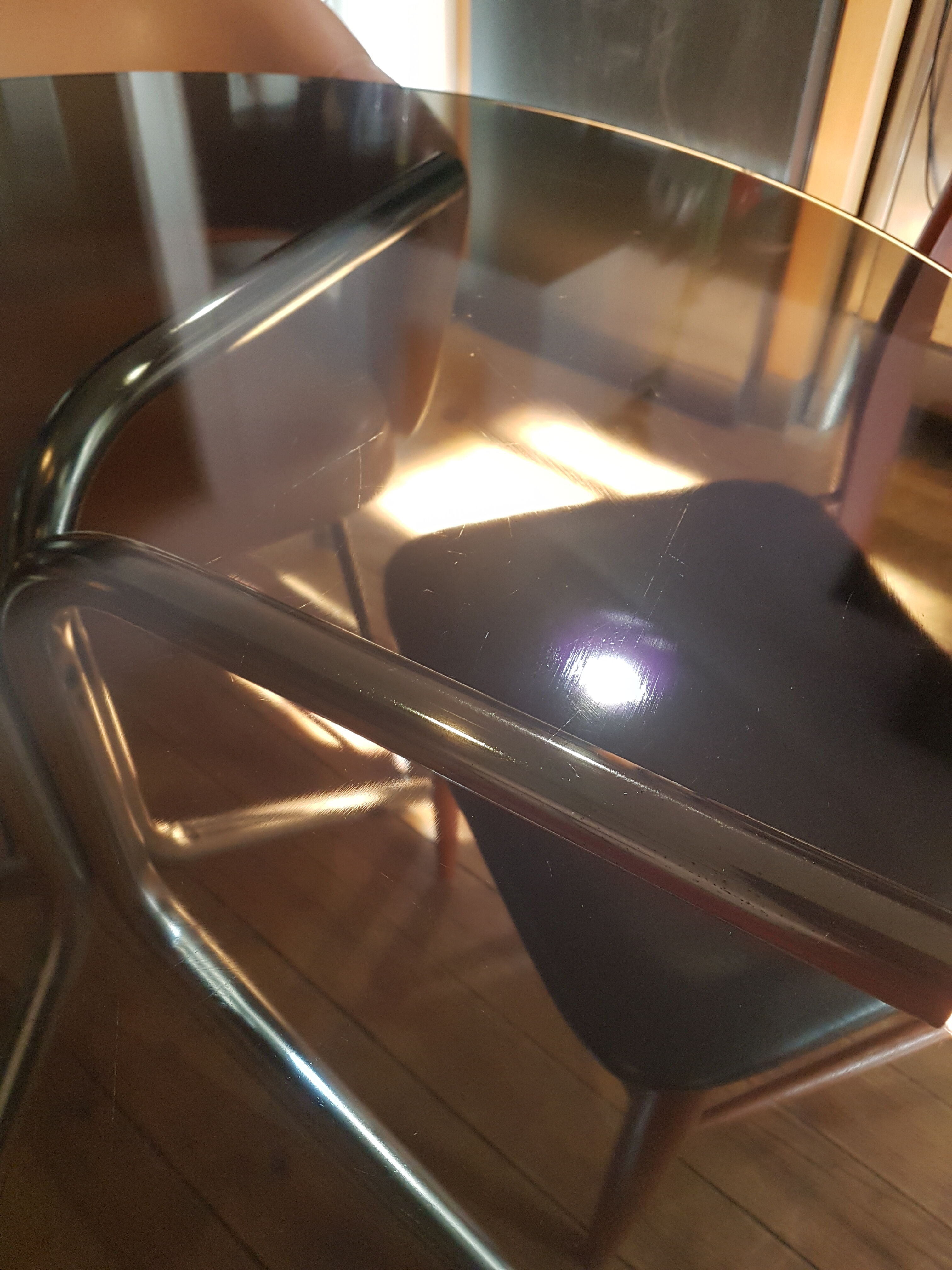 Smoked glass round table and chrome foot