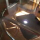 Smoked glass round table and chrome foot