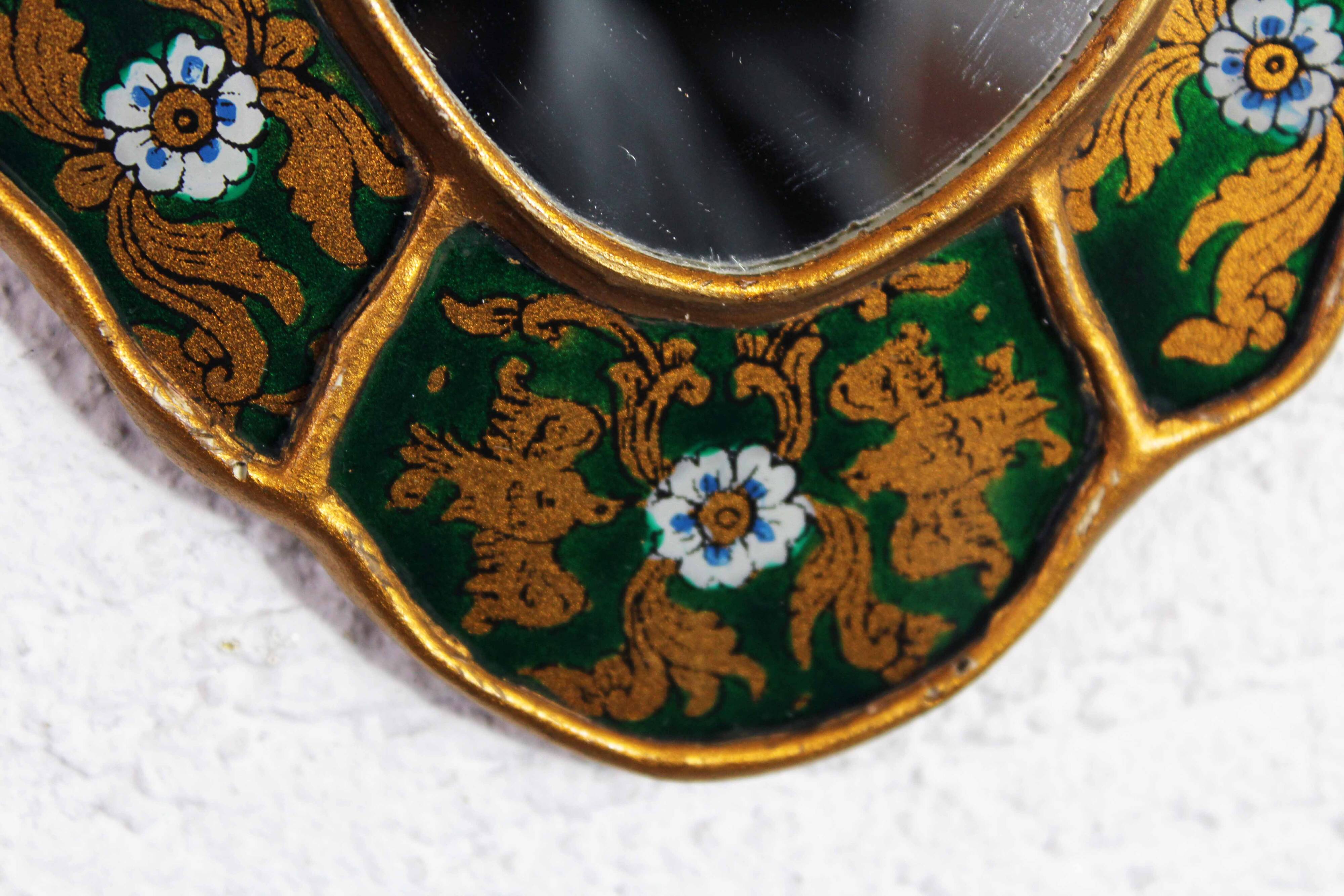 Golden mirror with decor