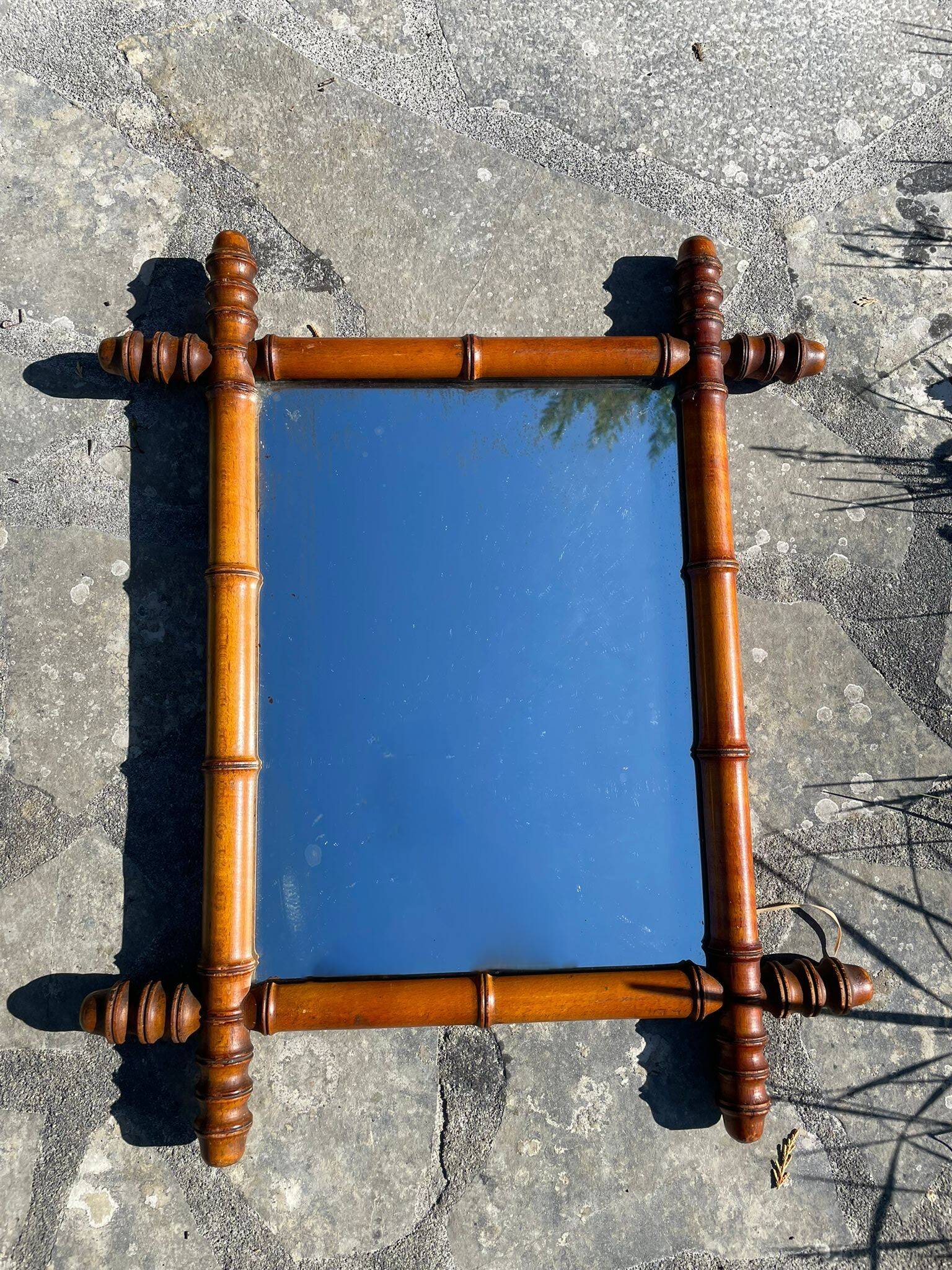 Vintage wooden mirror imitating bamboo