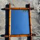 Vintage wooden mirror imitating bamboo
