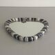 Small wall mirror, round triangle in black and white ceramic, 1950s, Germany.