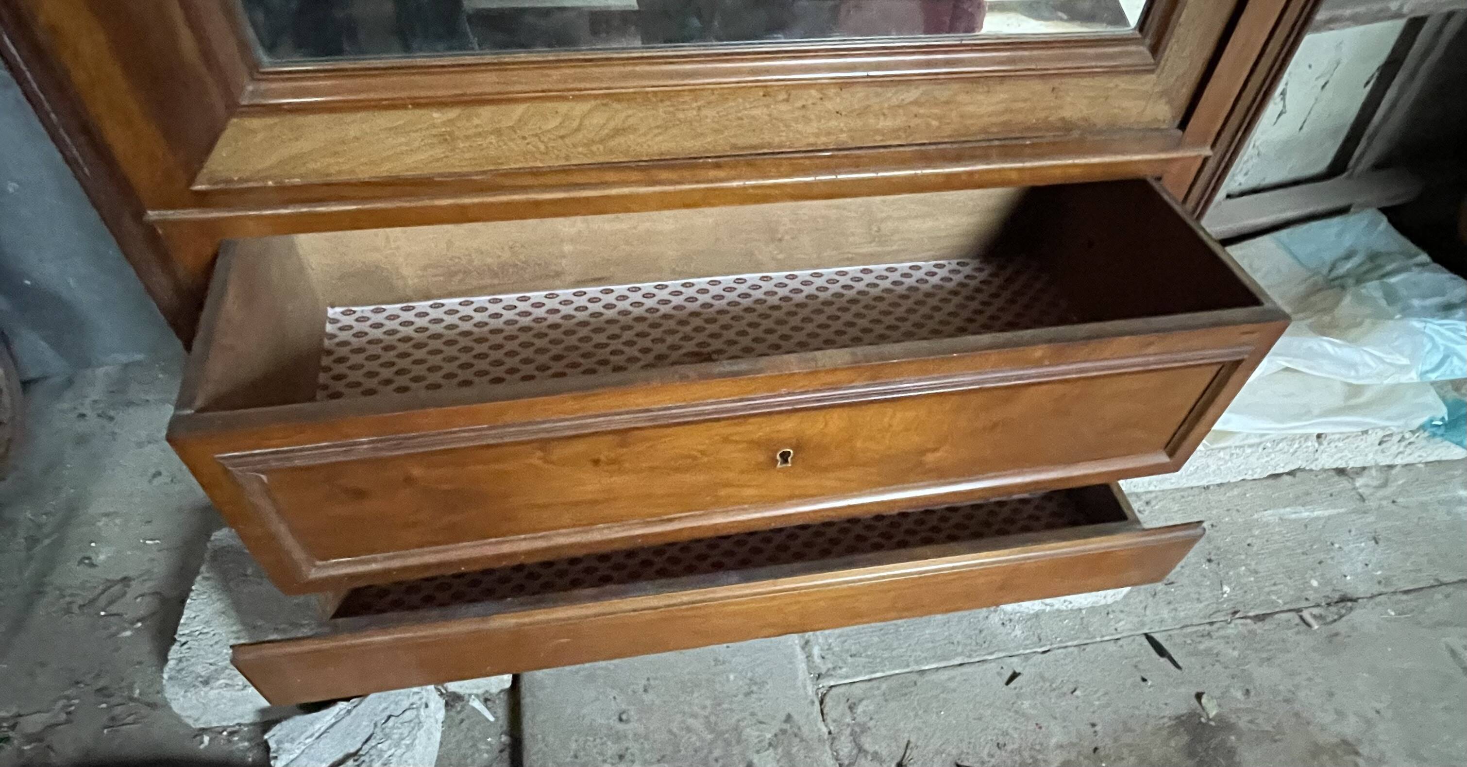 Antique wardrobe with a mirror door.