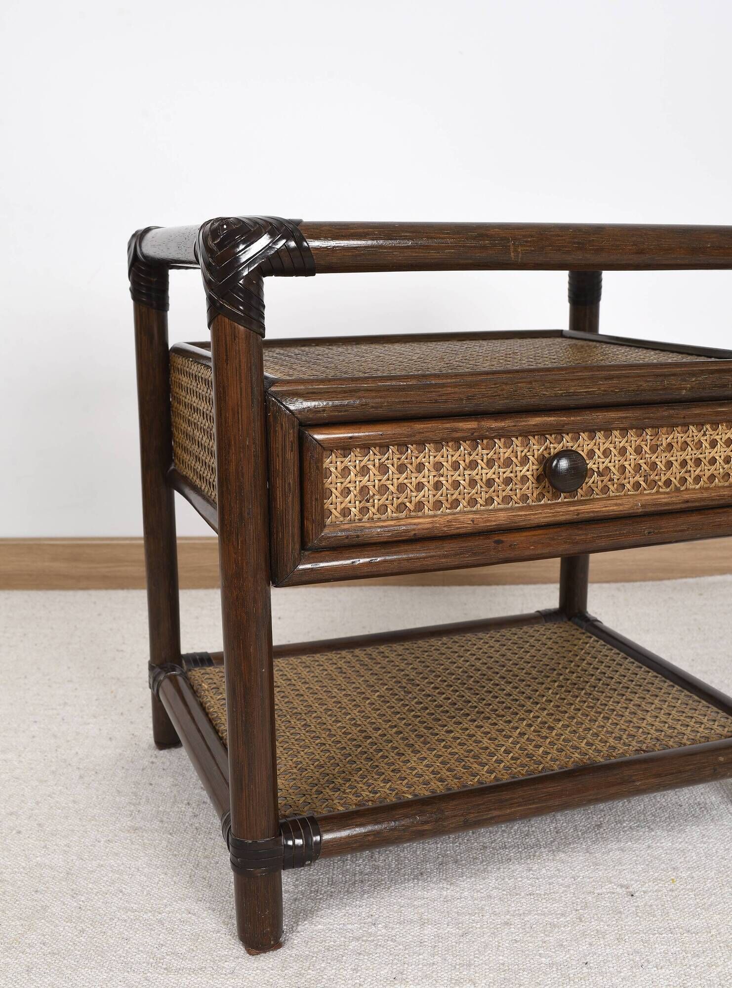 Rattan and cane bedside table, smoked glass top