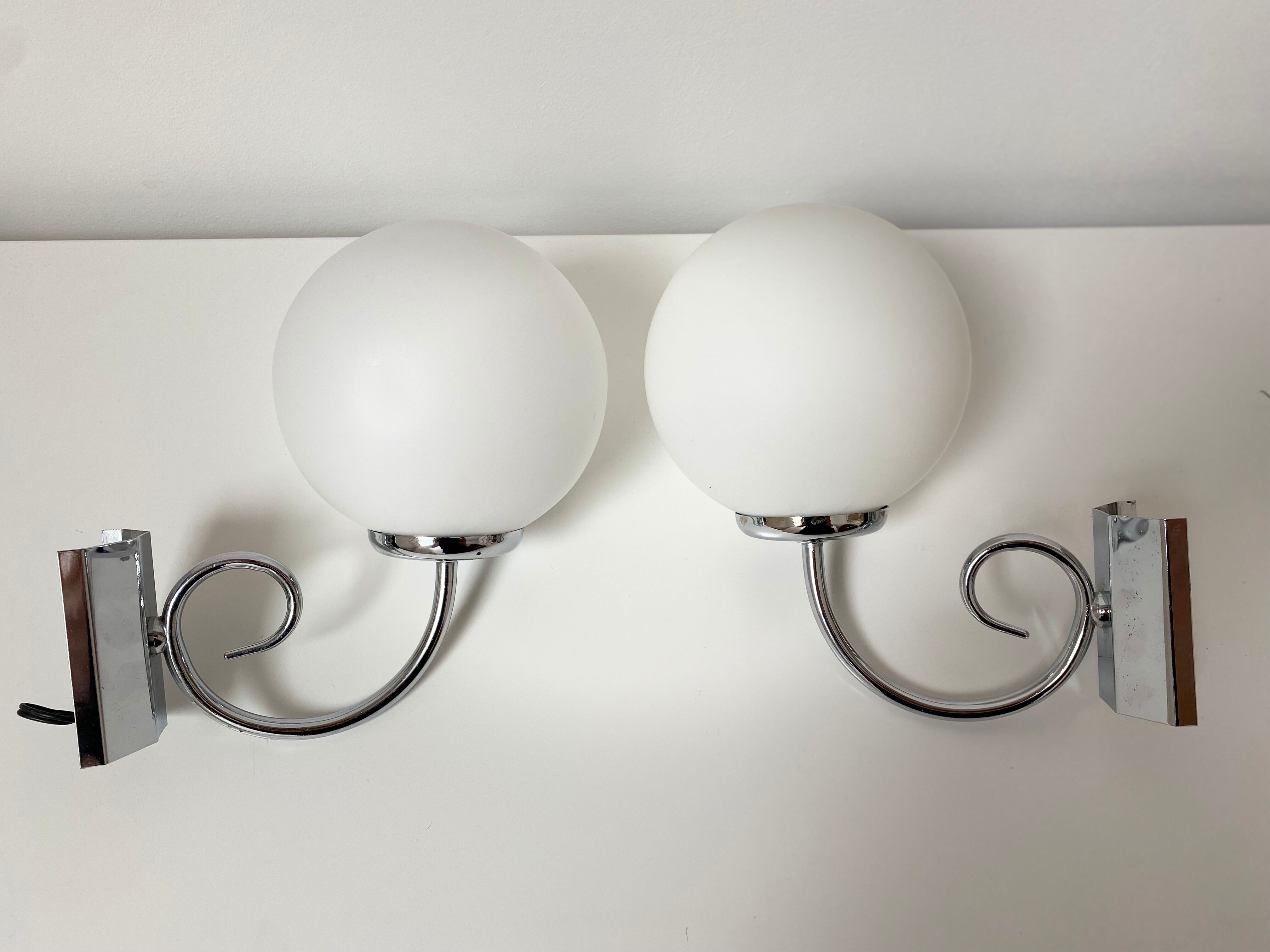 Pair of chrome and opaline metal wall lamps