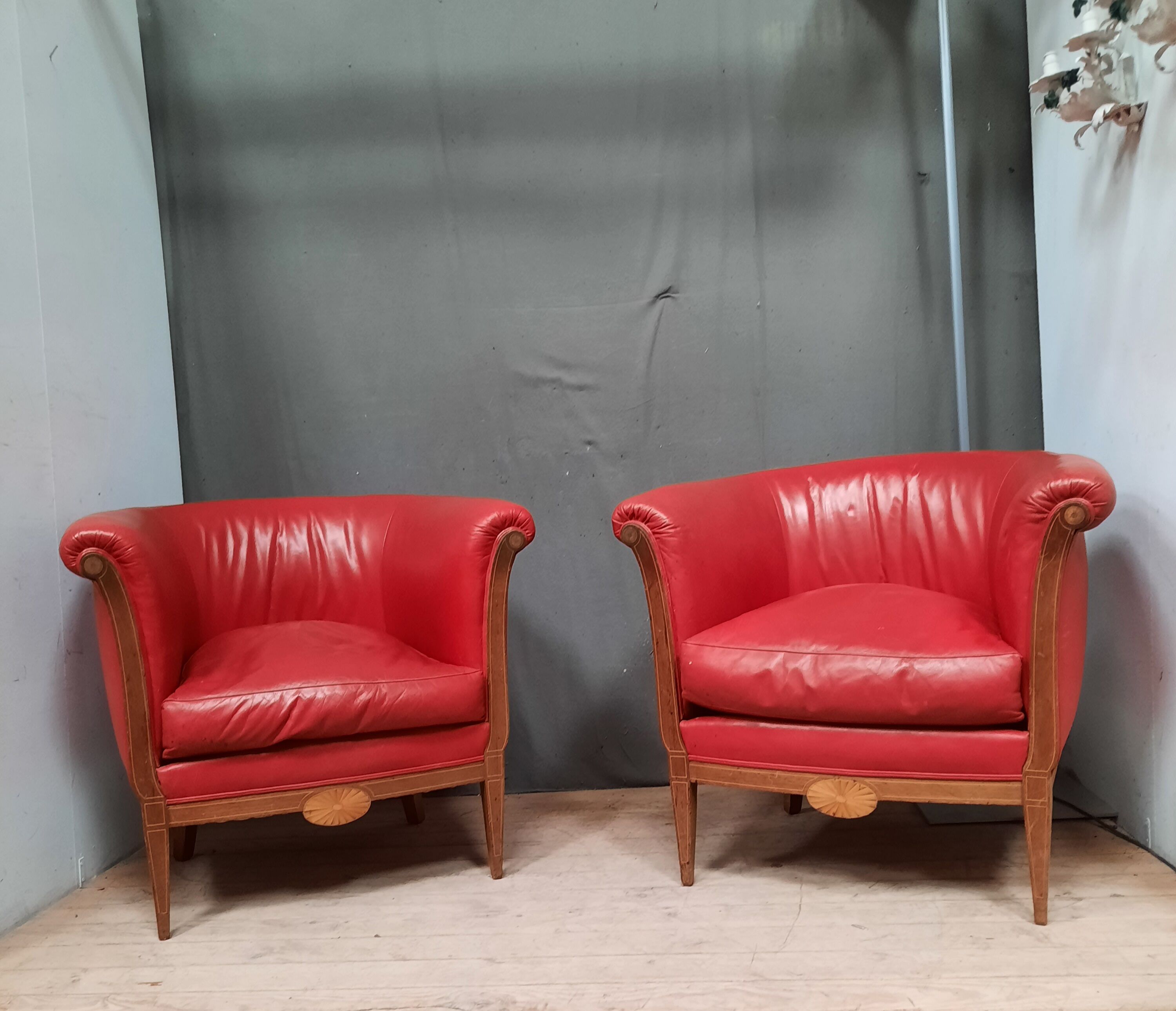 Pair of red leather armchairs