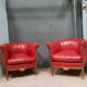 Pair of red leather armchairs