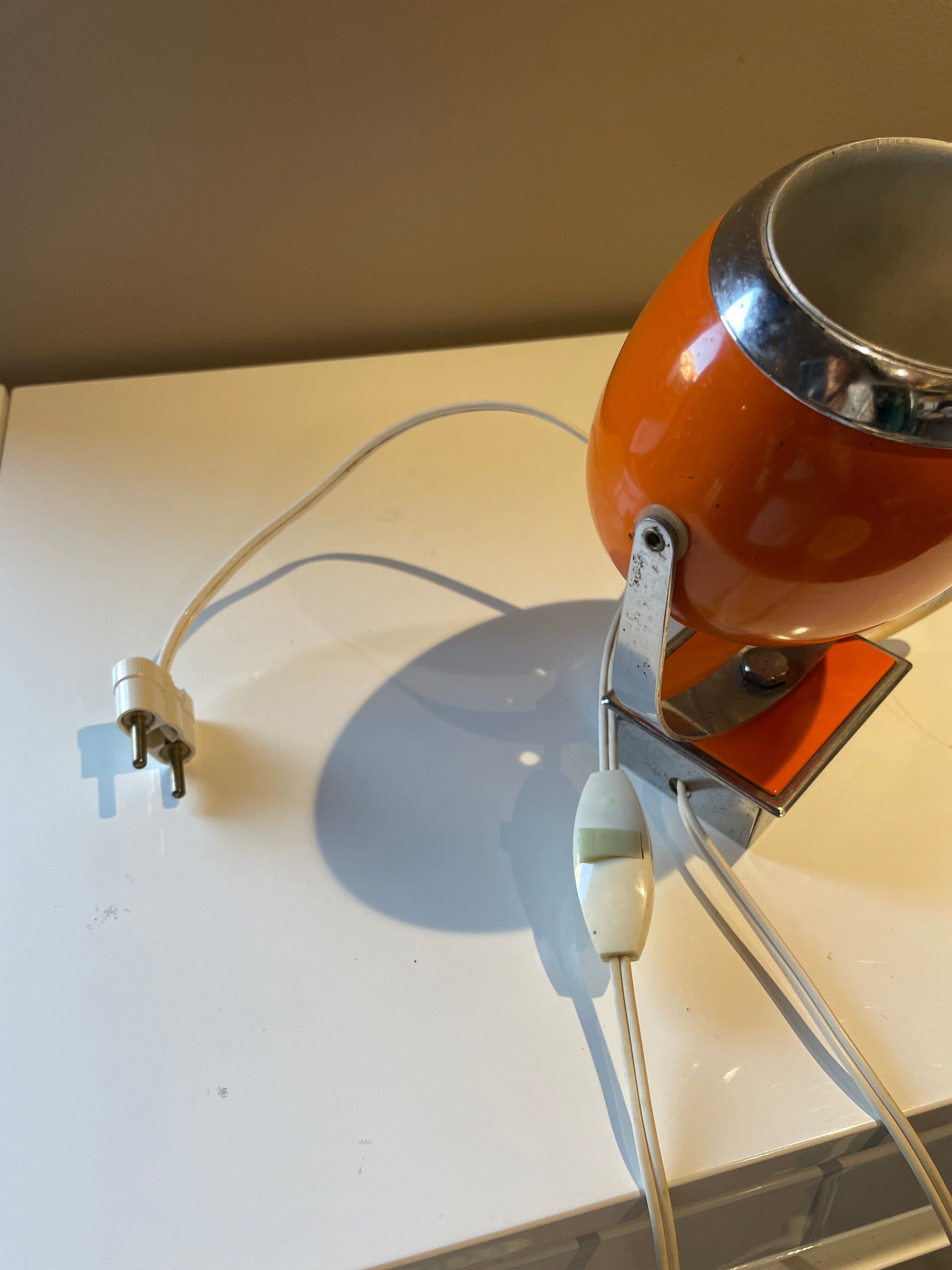 Orange eye ball wall lamp