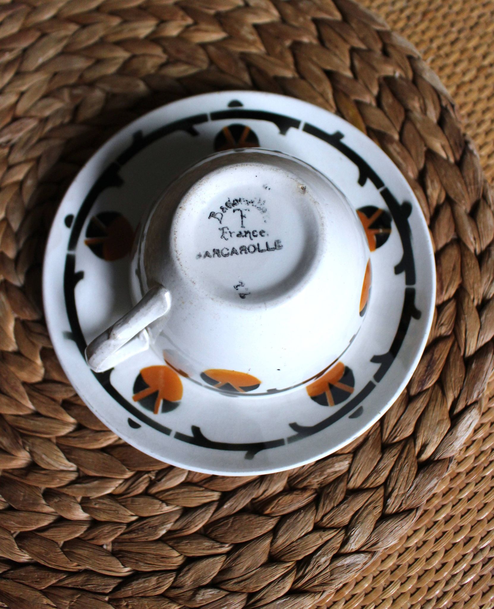 A large cup of chocolate tea, saucer Badonviller Barcarolle orange black.