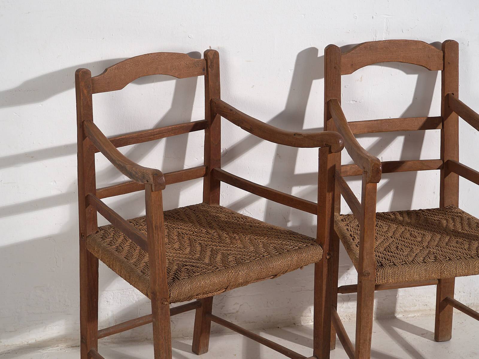 Two oak and rope armchairs, circa 1900